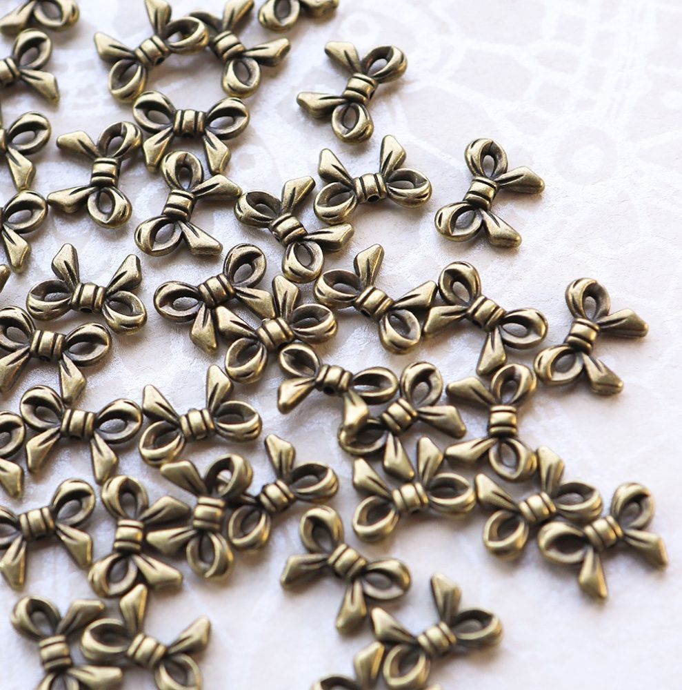 разделитель для бусин "бантик", цвет античная бронза, 14x10x3 мм