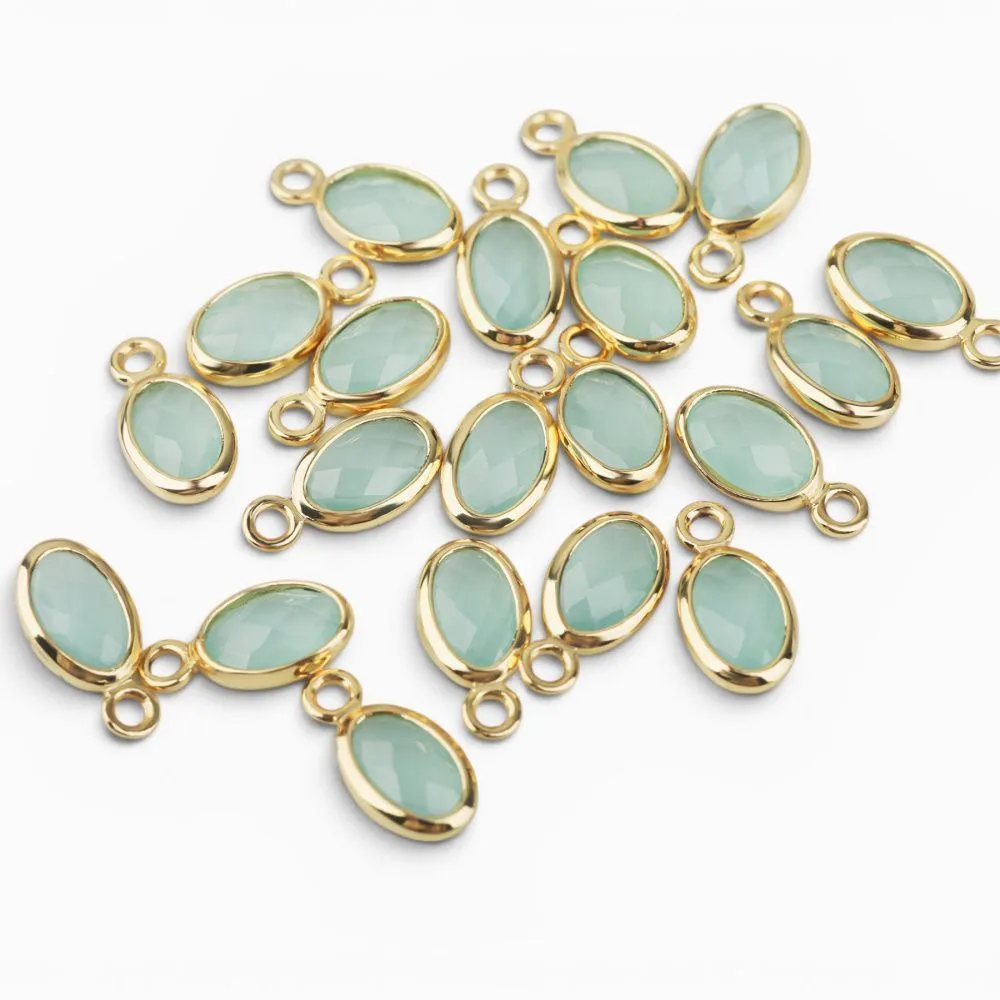 подвеска металл "эллипс", позолота/св.аквамарин, 9x4.5x2 мм